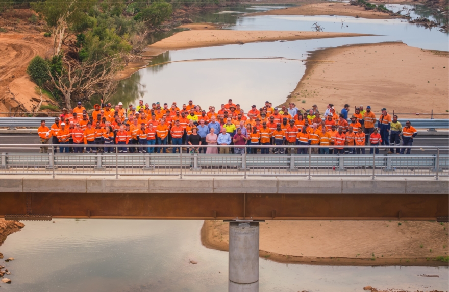 A Georgiou project team on a completed bridge